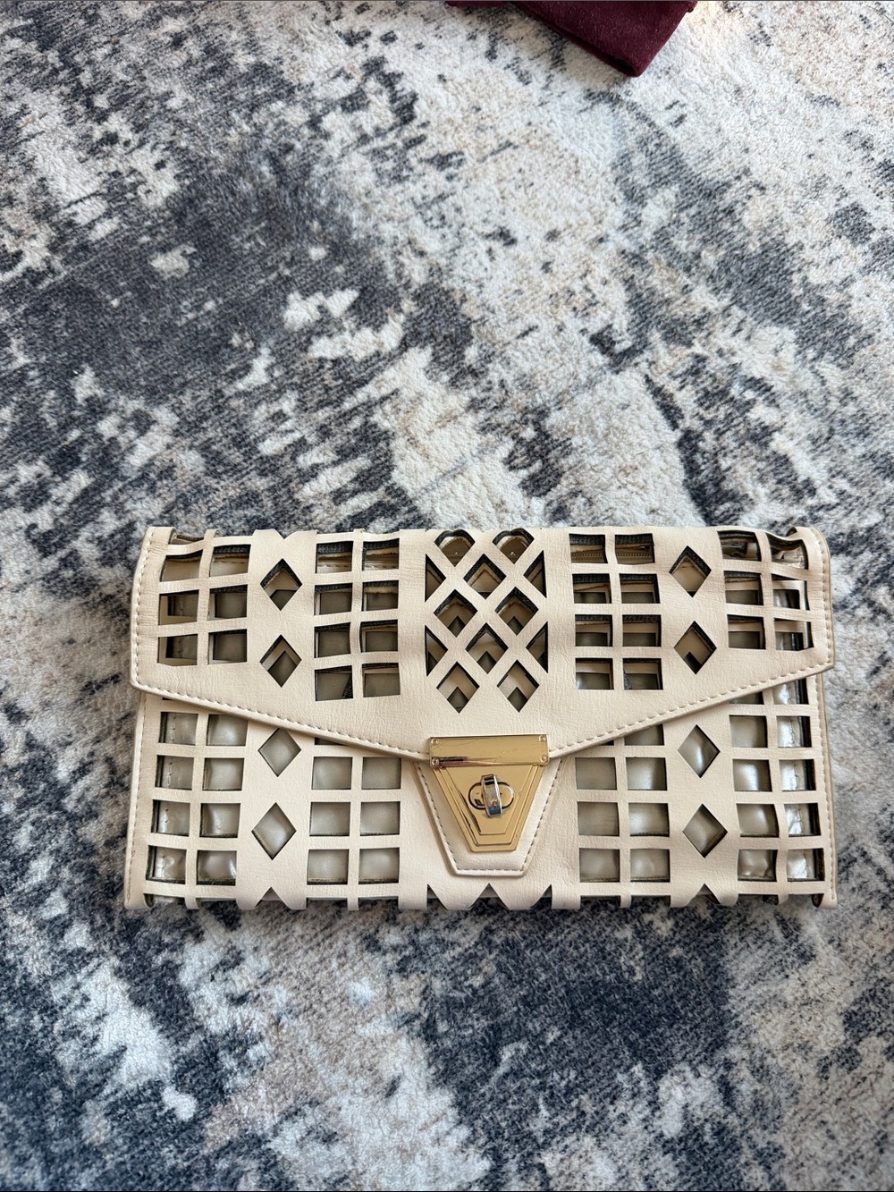 Elegant Cream Cutout Envelope Clutch with Gold Hardware